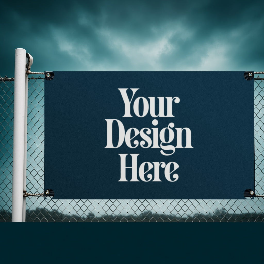13 oz vinyl banner on a fence with Your Design Here placeholder
