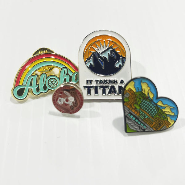 Die Struck Enamel Pins custom printed with a sample design