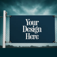 13 oz vinyl banner on a fence with Your Design Here placeholder