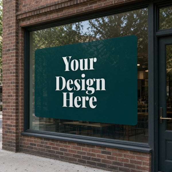 Adhesive vinyl decal on a storefront window with Your Design Here placeholder