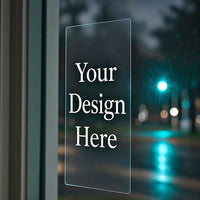 Clear vinyl sticker on a window with white Your Design Here artwork