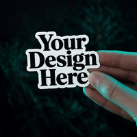 Die-cut sticker cut to the shape of the Your Design Here artwork