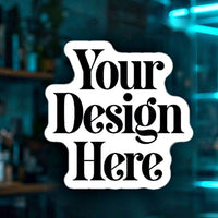 Window cling on storefront glass with Your Design Here placeholder